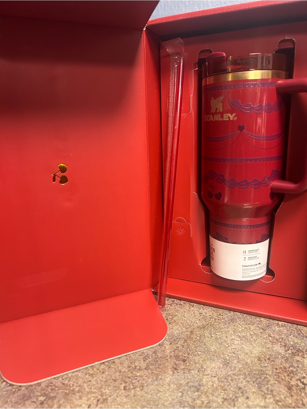 Stanley Red Travel Tumbler with Gold Accent and Handle